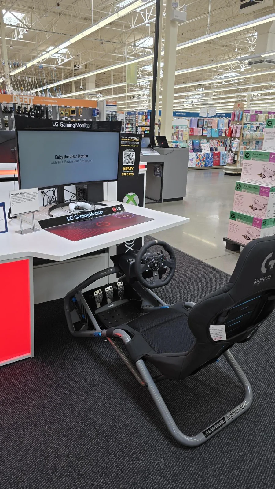 Fort Hood Main Store: a Playseat and Logitech wheel set up at the gaming table