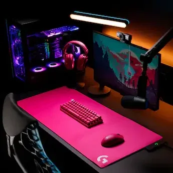 Reference look: magenta Logitech G keyboard, mouse and headset on a magenta desk mat with a Litra light and a Yeti mic